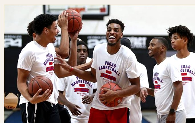 Vegas Basketball athletes smiling and holding basketballs at the showcase