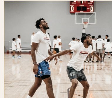 Two athletes training on an indoor court during the showcase